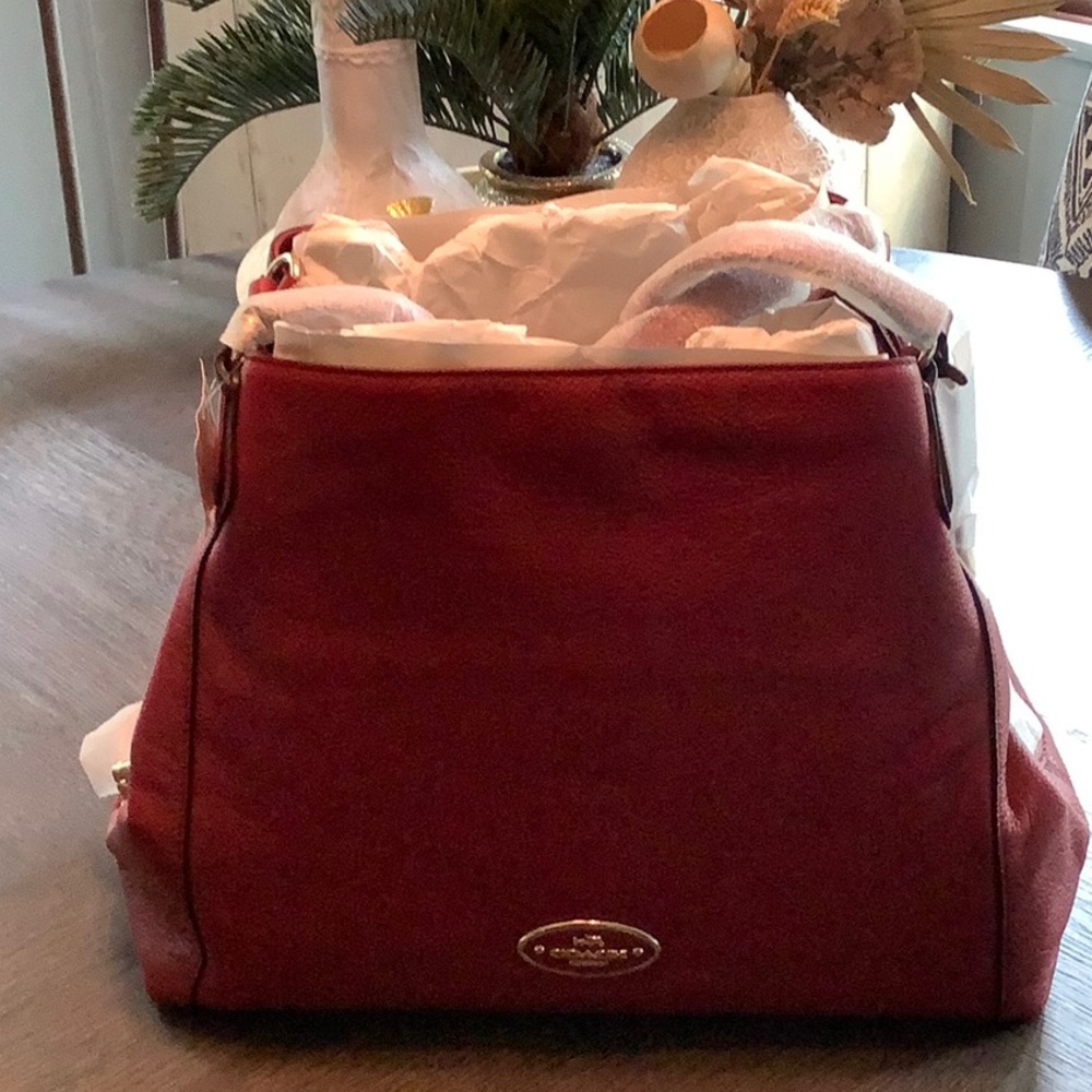 New  with tags Coach Edie red currant.